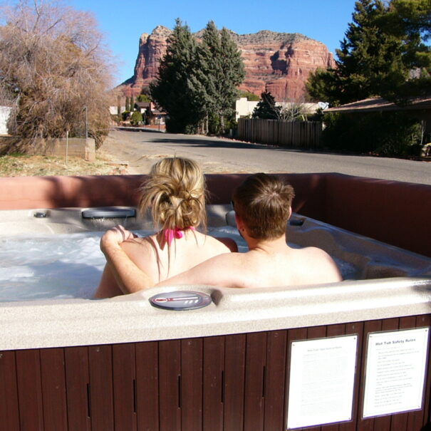 couple-in-hot-tub-with-red rock-vista